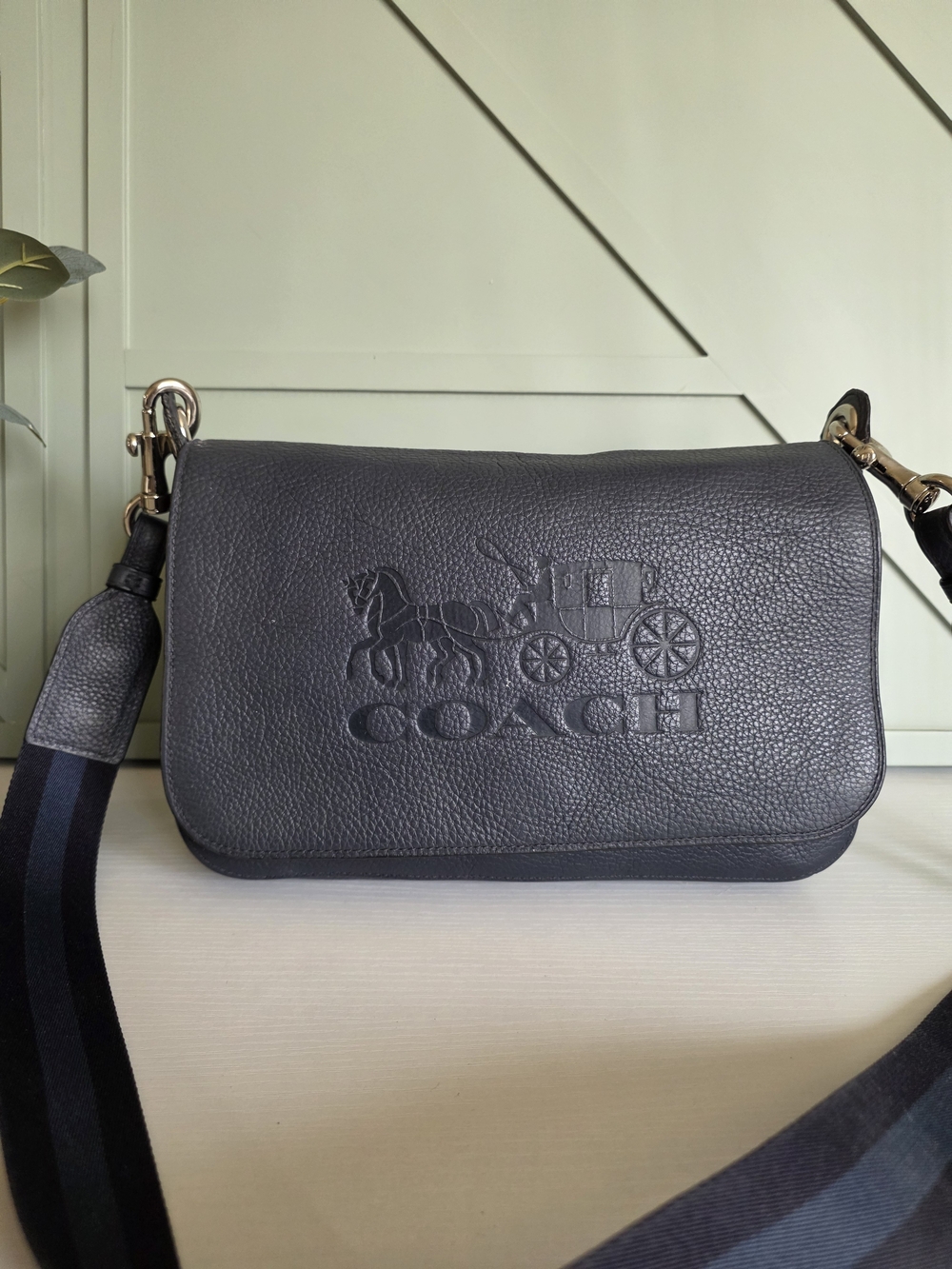 Coach Jes Messenger Bag, crafted in a rich pebbled leather